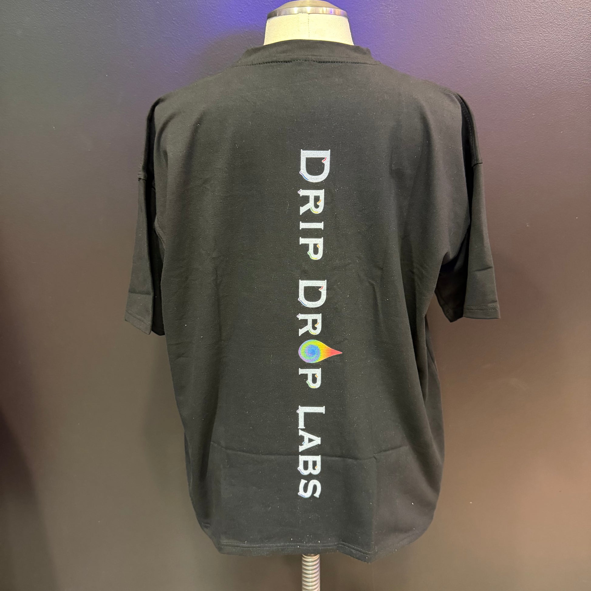 Oversized Rainbow Compound shirt by Drip Drop Labs featuring vibrant rainbow tie-dye pattern and relaxed fit.