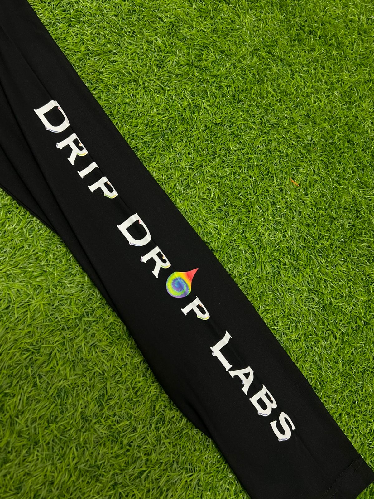 Black Drip Drop Labs athletic hoodie with performance fabric, featuring a front logo and comfortable fit for active wear.