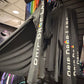 Black Drip Drop Labs athletic hoodie with performance fabric, featuring a hood, logo on chest, and sporty design.