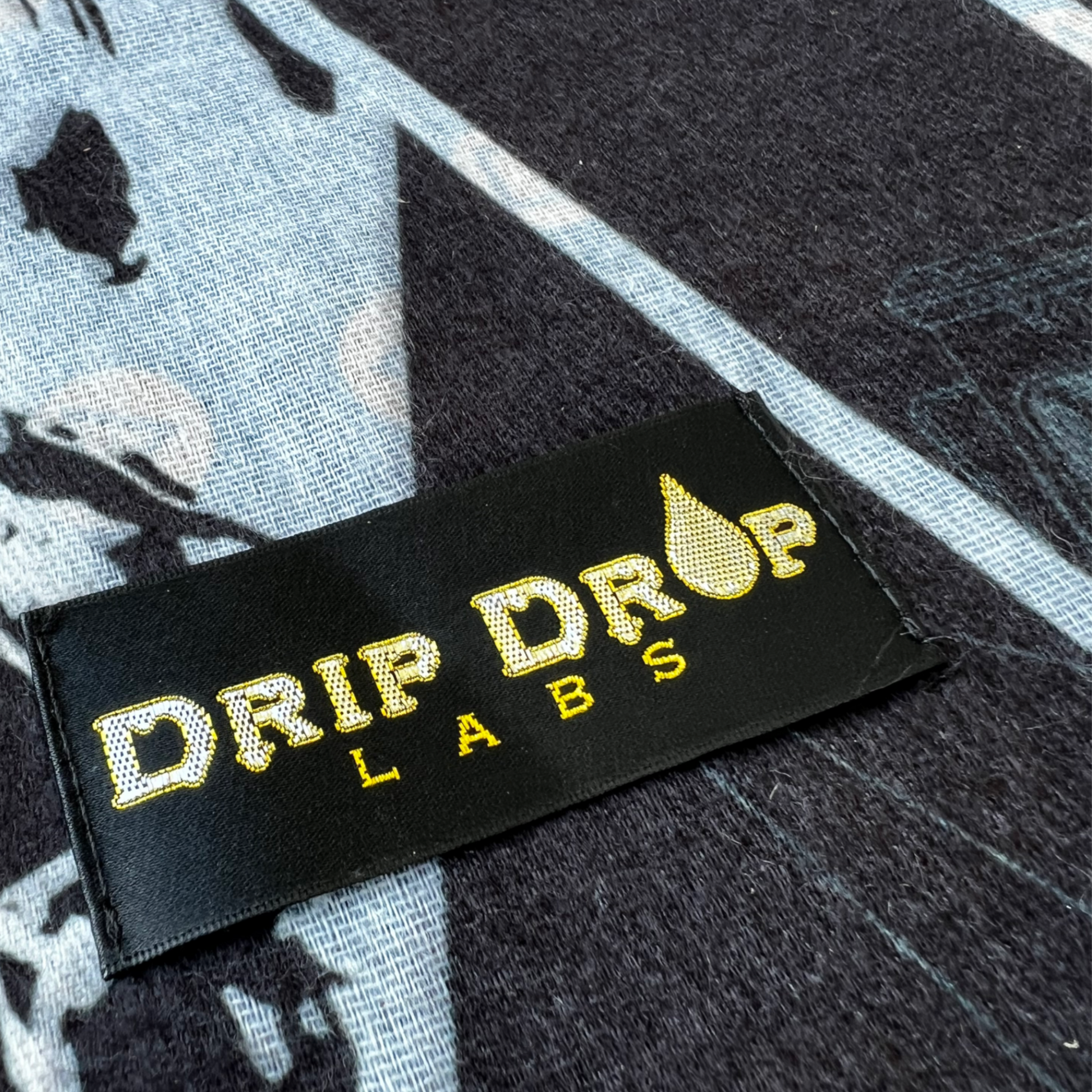 Drip Drop Labs PS Tribute Pashmina scarf with soft, luxurious fabric and intricate design, perfect for elegant accessories.