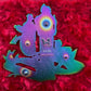 Drip Drop Labs PS Tribute pins featuring detailed design and vibrant colors, perfect for collectible pin enthusiasts.