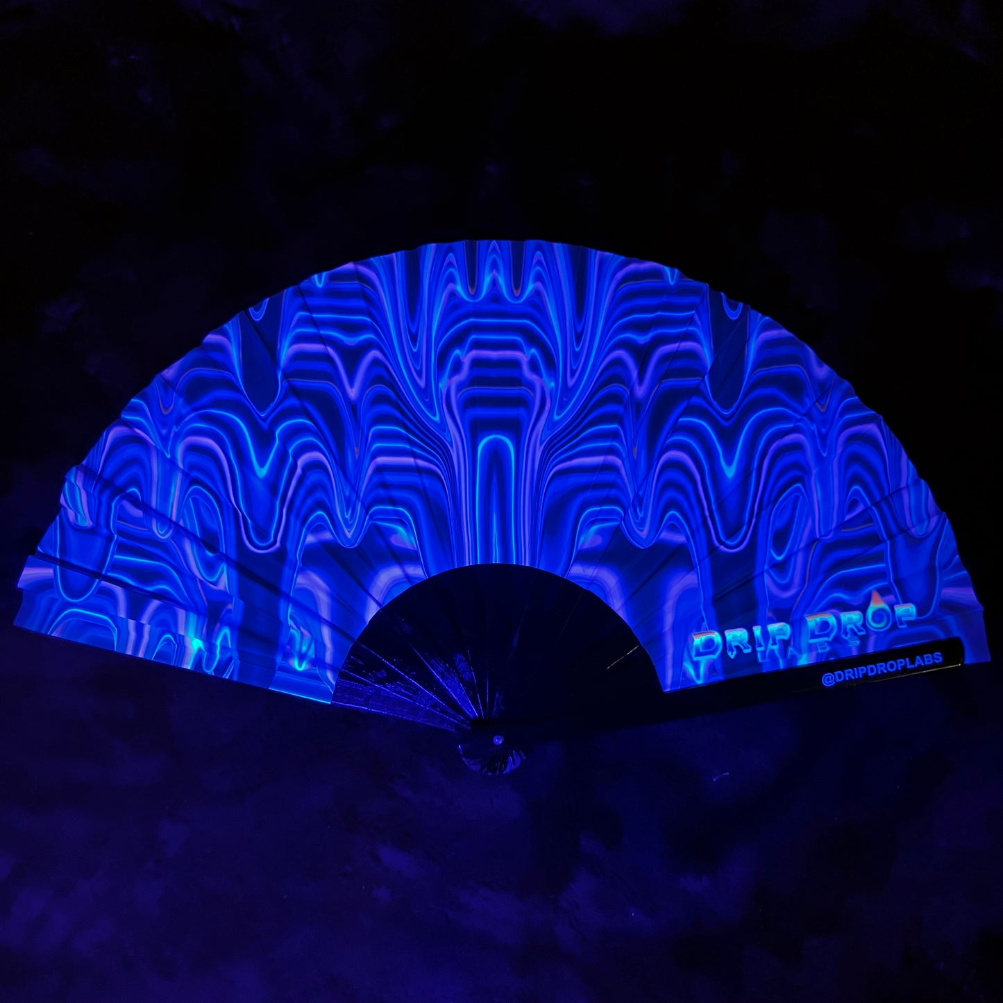Purple Drip Glow Fan by Drip Drop Labs with LED lights and drip design, perfect for vibrant, illuminated cooling.
