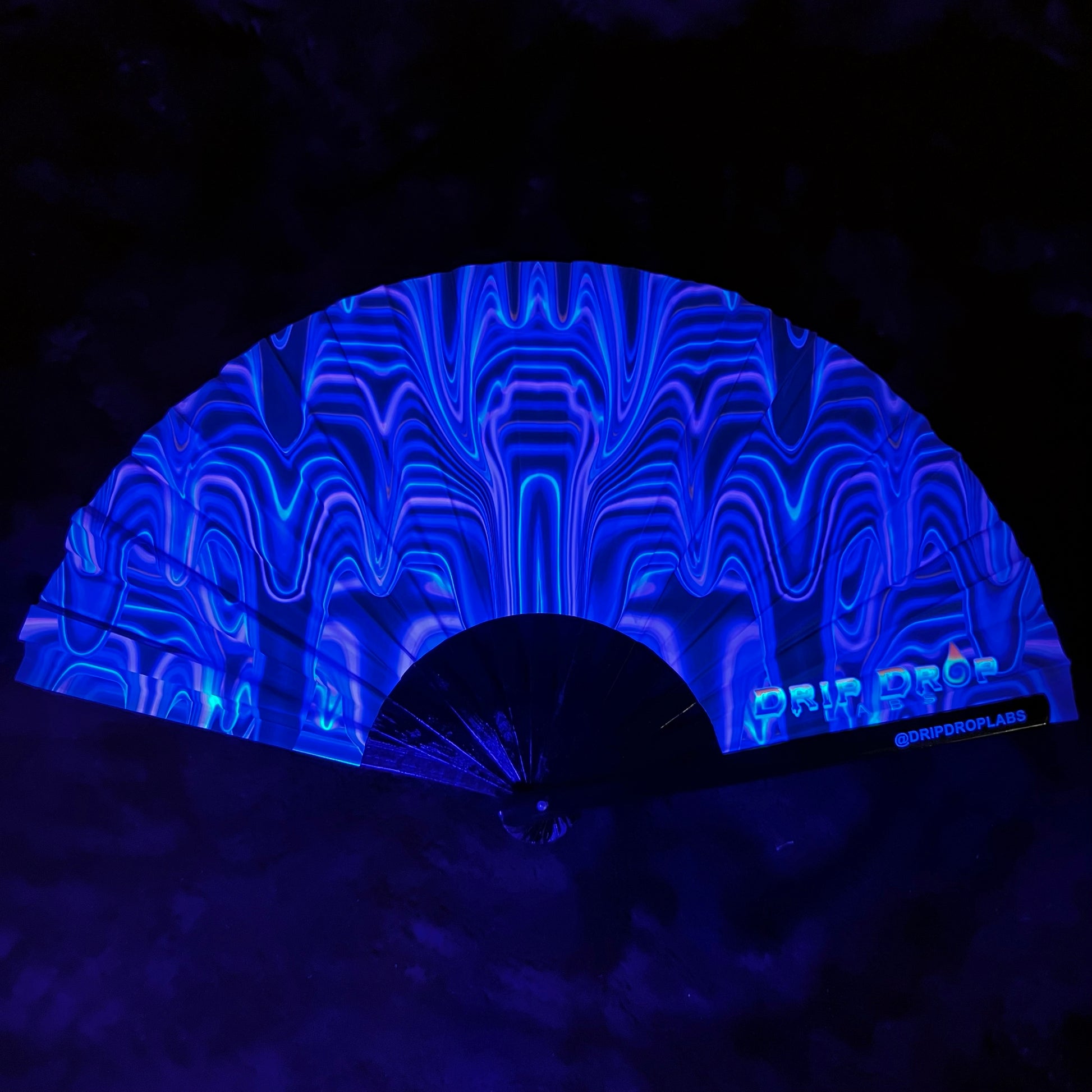 Purple Drip Glow Fan by Drip Drop Labs with LED lights and drip design, perfect for vibrant, illuminated cooling.