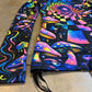 Rainbow Portal Hooded Rave Romper by Drip Drop Labs featuring psychedelic rainbow patterns and a hood, perfect for festival wear.