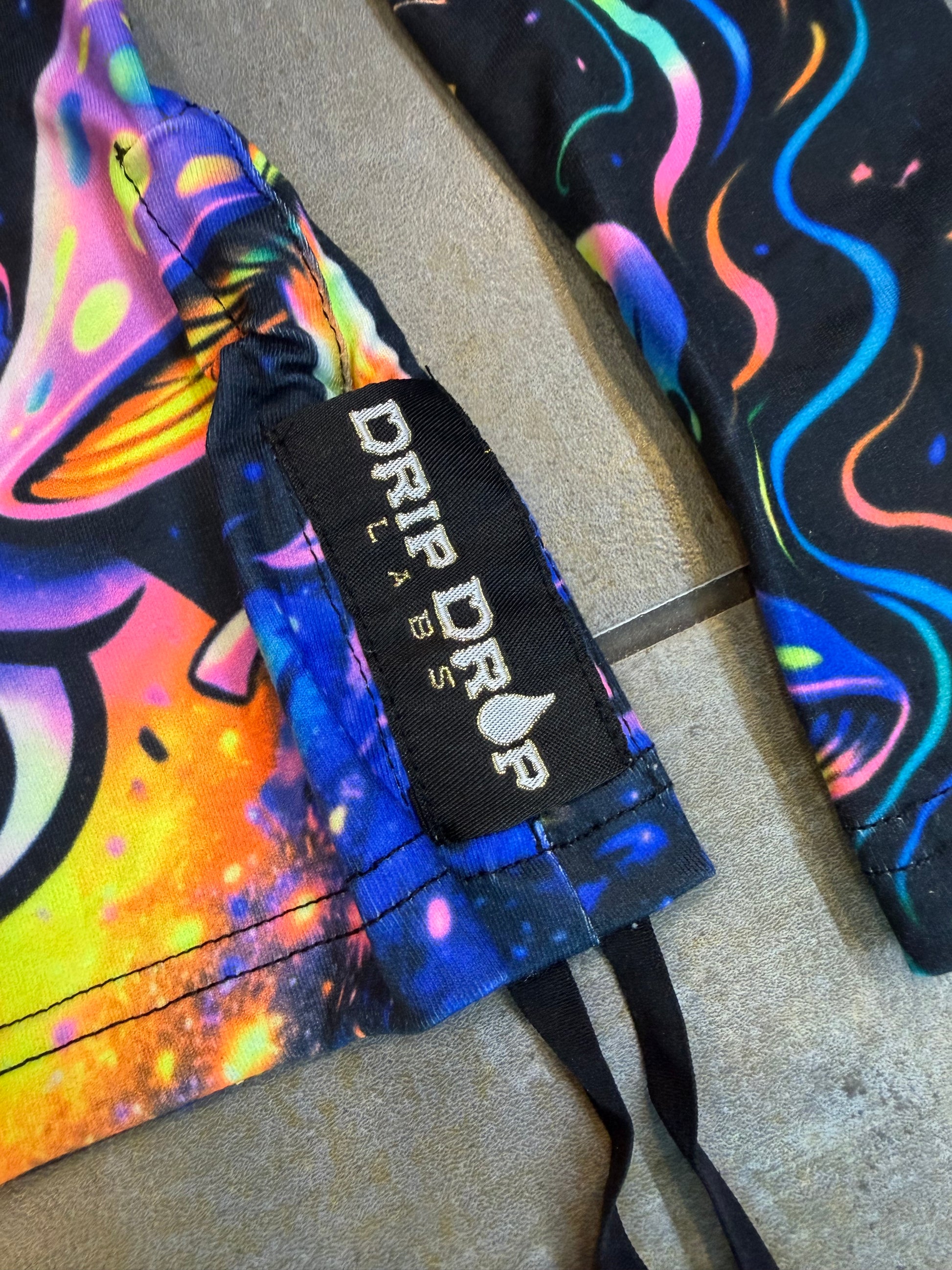Rainbow Portal Hooded Rave Romper by Drip Drop Labs featuring psychedelic print, hood, and vibrant festival-ready design.