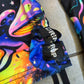 Rainbow Portal Hooded Rave Romper by Drip Drop Labs featuring vibrant psychedelic patterns and a hood, perfect for festival wear.
