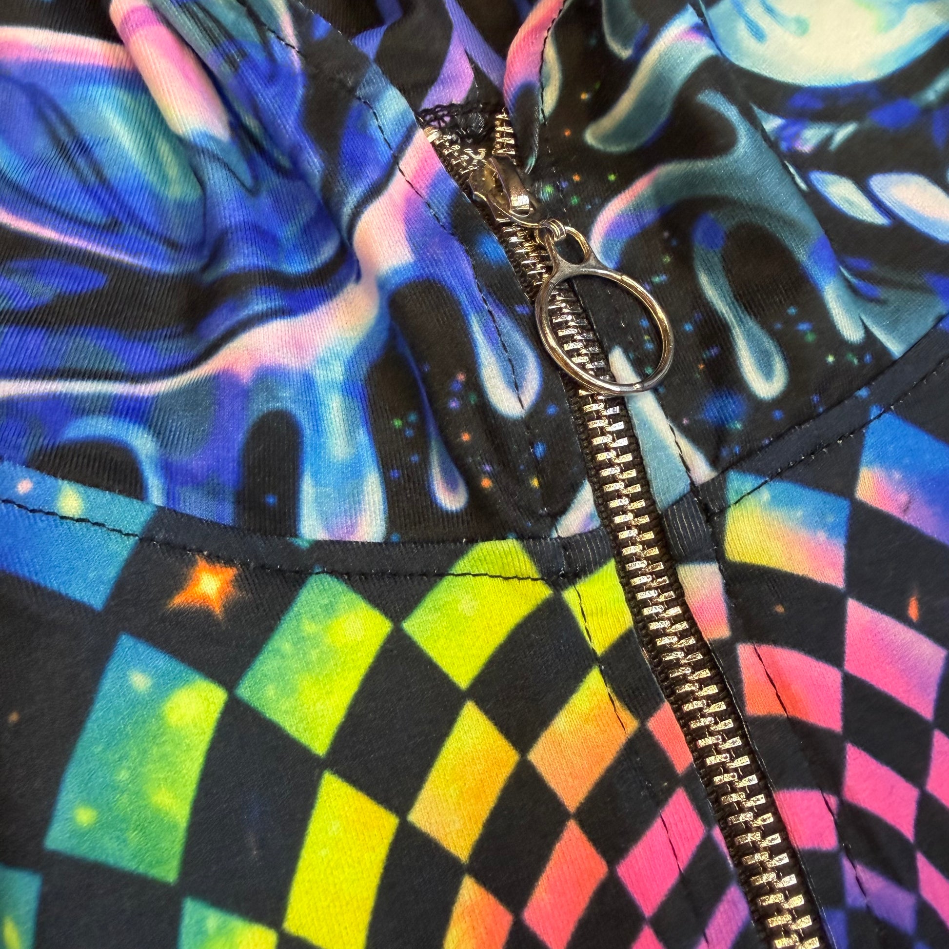 Rainbow Portal Hooded Rave Romper by Drip Drop Labs featuring a psychedelic rainbow design and hood, perfect for festival wear.