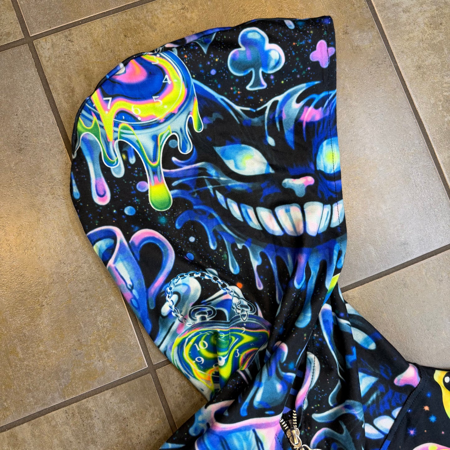 Rainbow Portal Hooded Rave Romper by Drip Drop Labs featuring psychedelic festival-inspired design and vibrant rainbow colors.