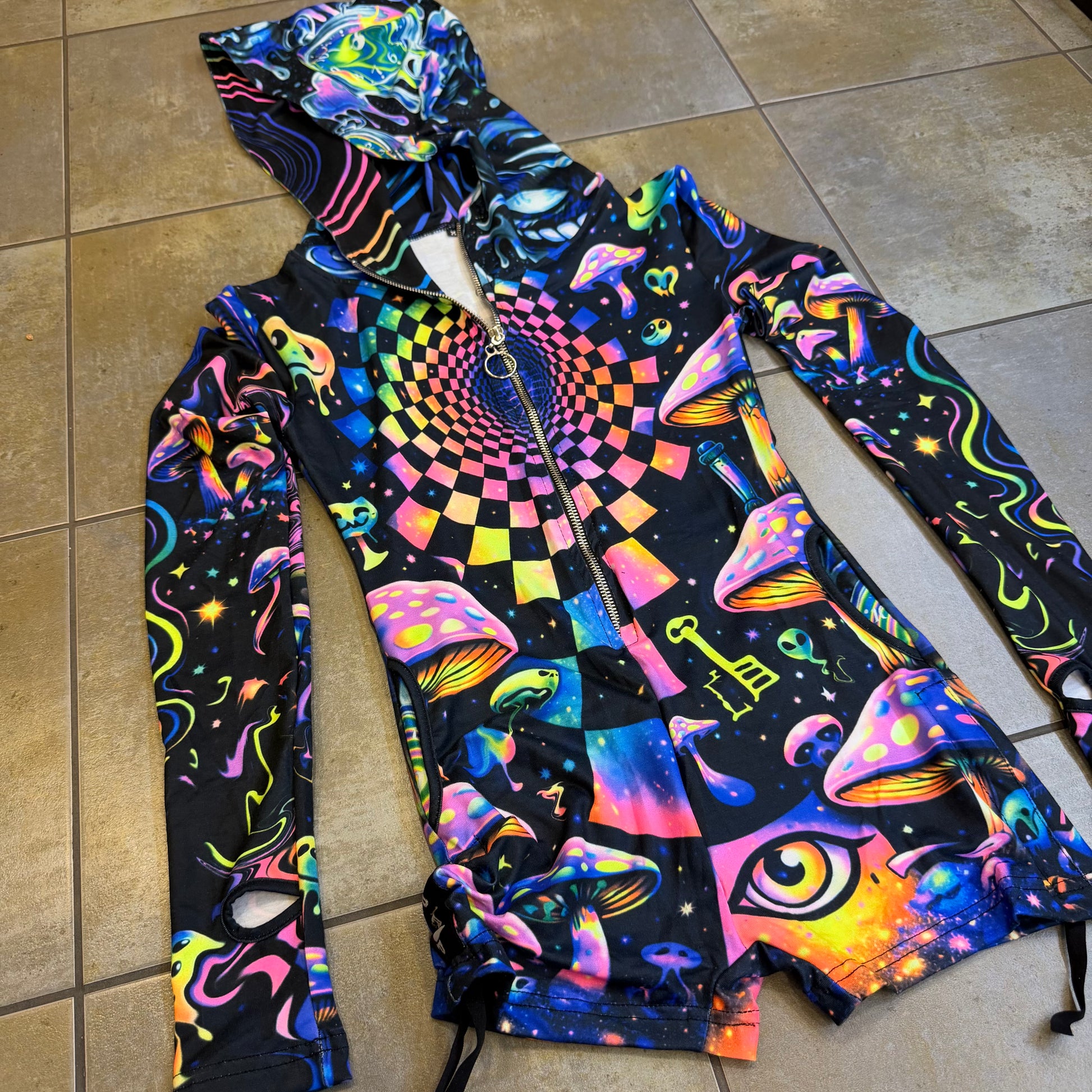 Rainbow Portal Hooded Rave Romper by Drip Drop Labs featuring a psychedelic rainbow design and hood, ideal for festival wear.