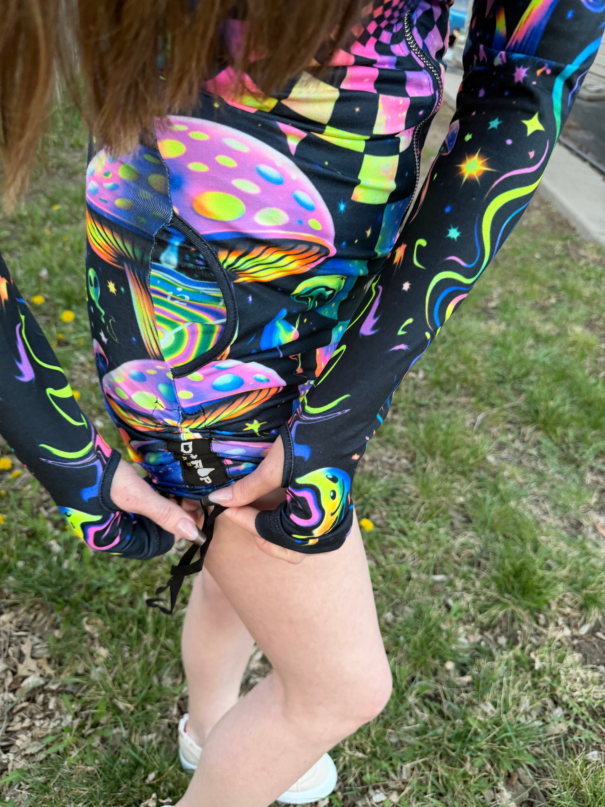 Rainbow Portal Hooded Rave Romper by Drip Drop Labs featuring a colorful, psychedelic design with a hood and festival-ready style.