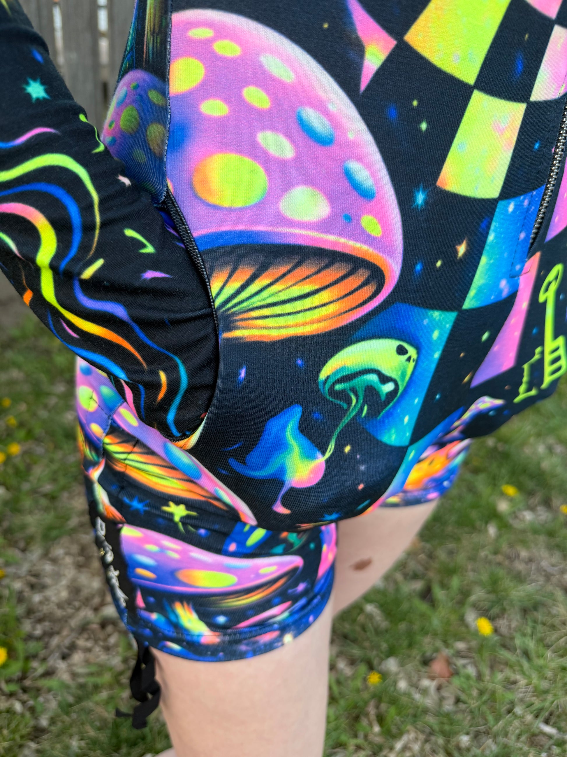 Rainbow Portal Hooded Rave Romper by Drip Drop Labs, featuring psychedelic festival print and vibrant hood for energetic dance events.