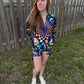 Rainbow Portal Hooded Rave Romper by Drip Drop Labs, featuring psychedelic festival-inspired design with a hood and vibrant colors.
