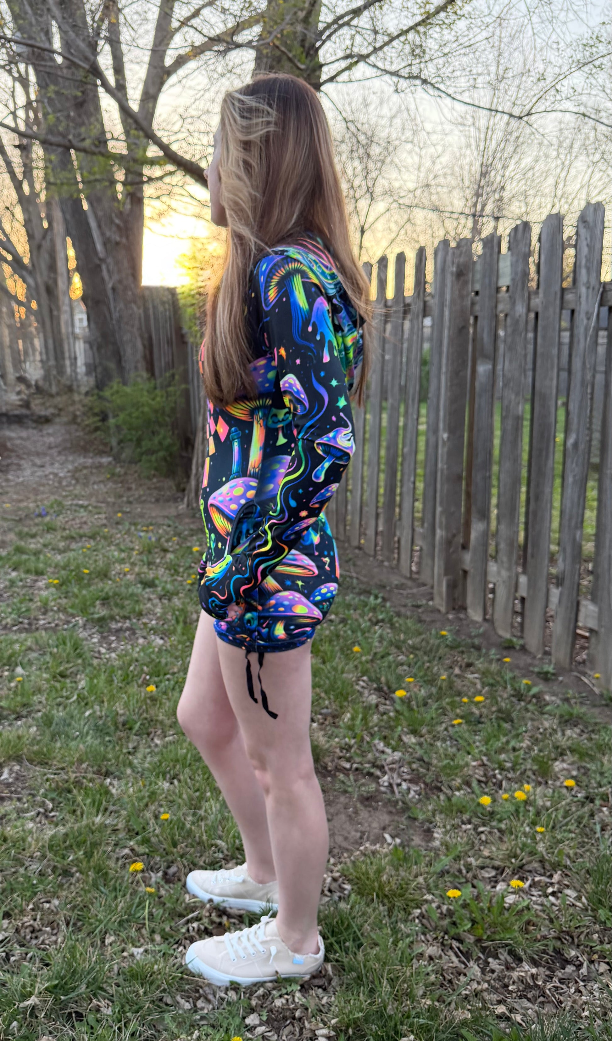 Rainbow Portal Hooded Rave Romper by Drip Drop Labs featuring a psychedelic rainbow design and hood, perfect for festival wear.