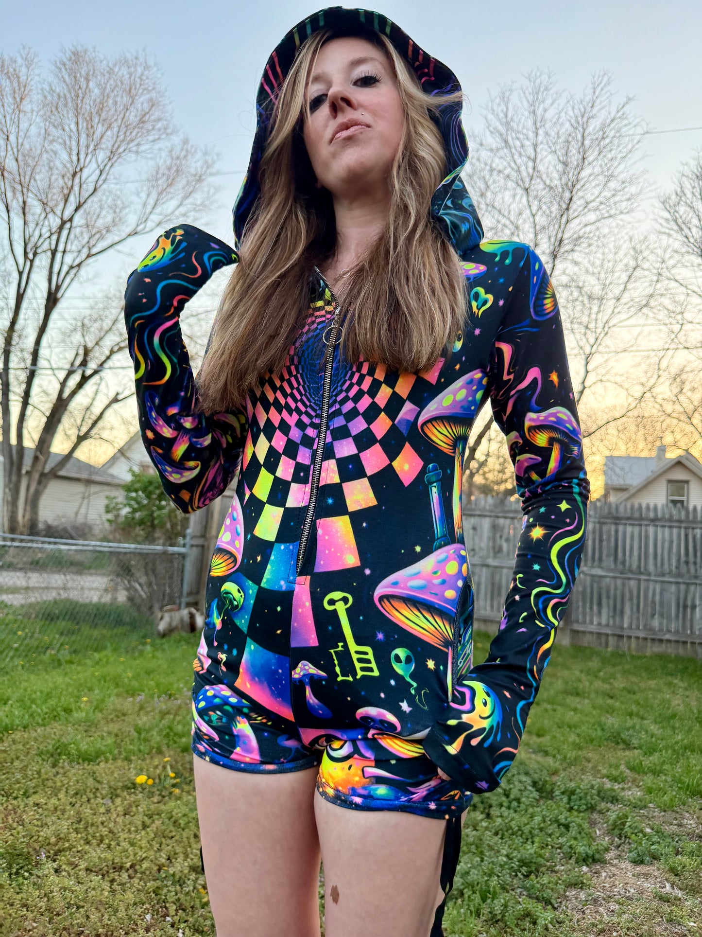 Rainbow Portal Hooded Rave Romper by Drip Drop Labs featuring a psychedelic rainbow design and hood, perfect for festival wear.