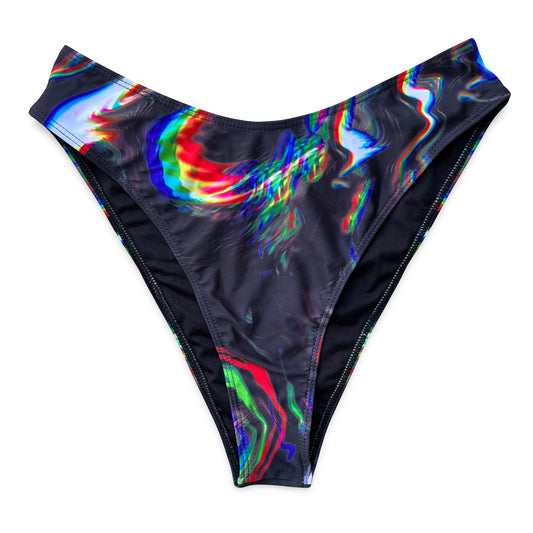 Women’s Chromatic Seduction bikini rave bottoms by Drip Drop Labs with vibrant, colorful patterns and a snug fit for active wear.