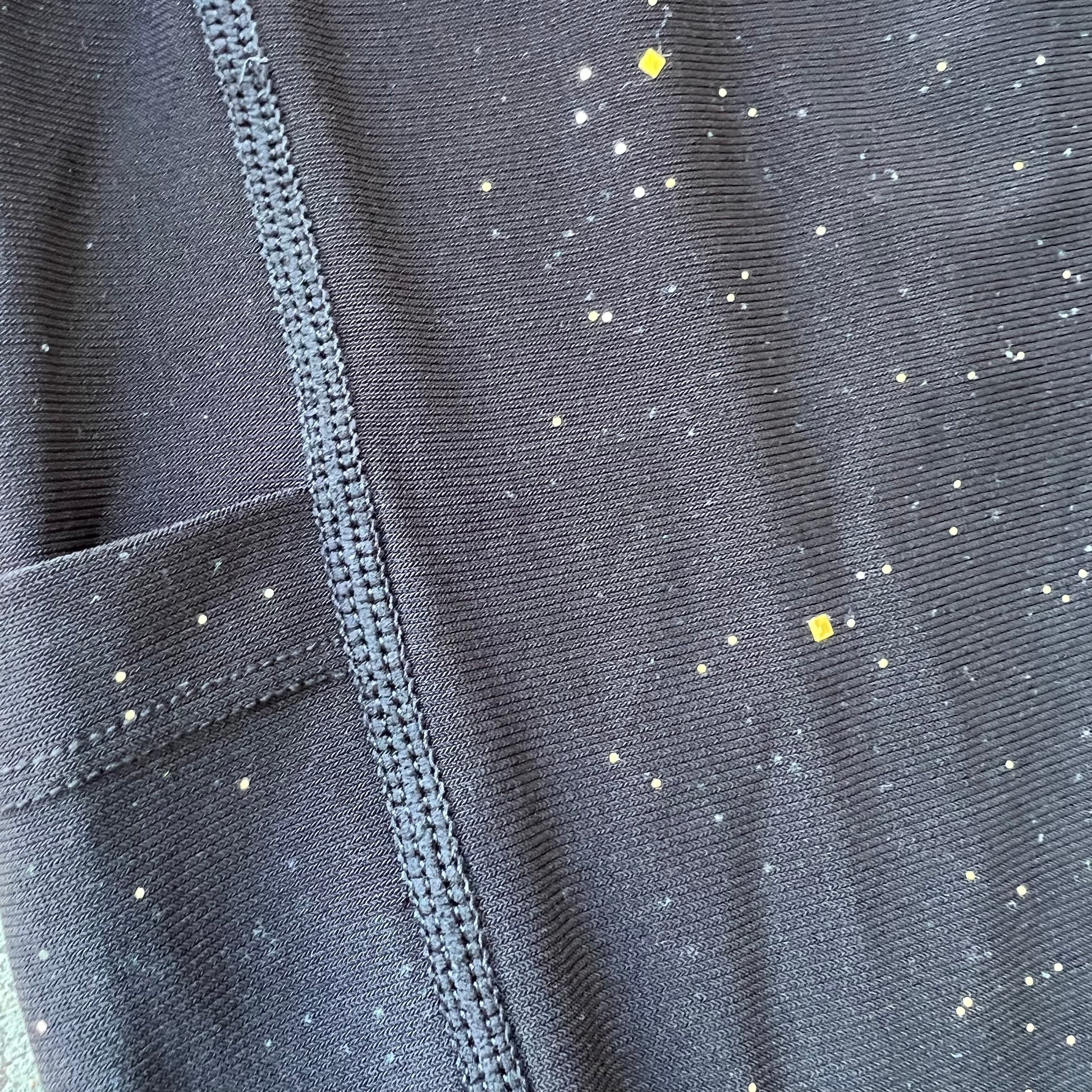 Drip Drop Labs Galactic Leggings featuring a cosmic starry pattern, close-up view of vibrant galaxy print on stretchy fabric.