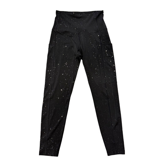 Dark galaxy-themed leggings from Drip Drop Labs featuring cosmic patterns and a comfortable fit.