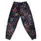 Limited edition Drip Drop Labs Frequency Bloom velvet parachute pants with vibrant floral pattern and relaxed fit.