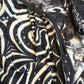 Dark galactic-themed hooded rave romper by Drip Drop Labs, featuring a cosmic print and festival-ready fit.