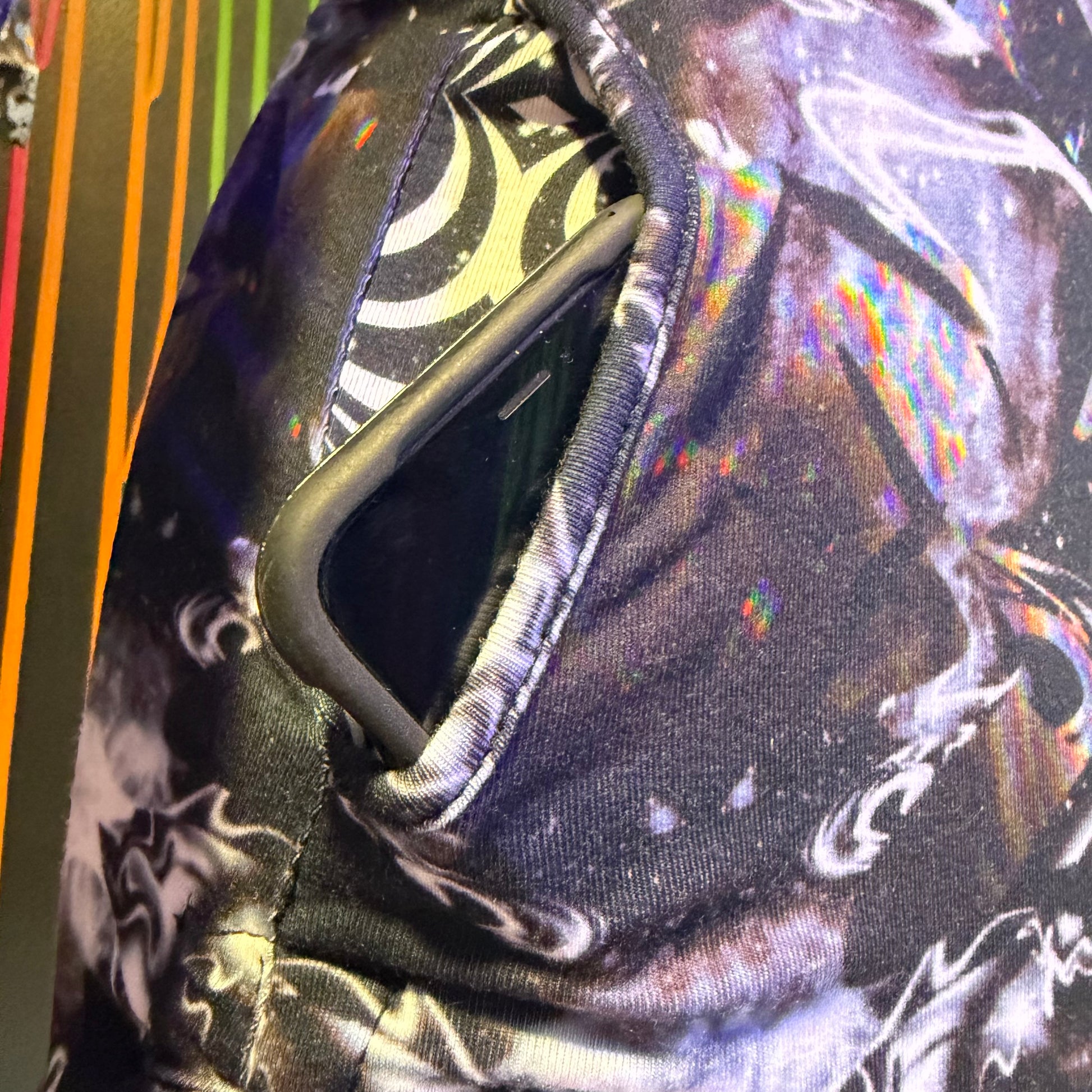 Dark galactic hooded rave romper by Drip Drop Labs, featuring cosmic print and festival-ready fit, perfect for night events.