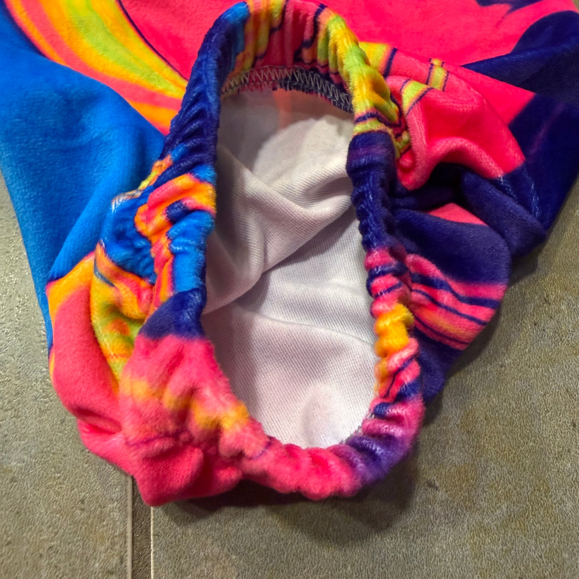 Velvet Sunset Drip Parachute Pants by Drip Drop Labs featuring a relaxed fit and vibrant sunset-inspired design.