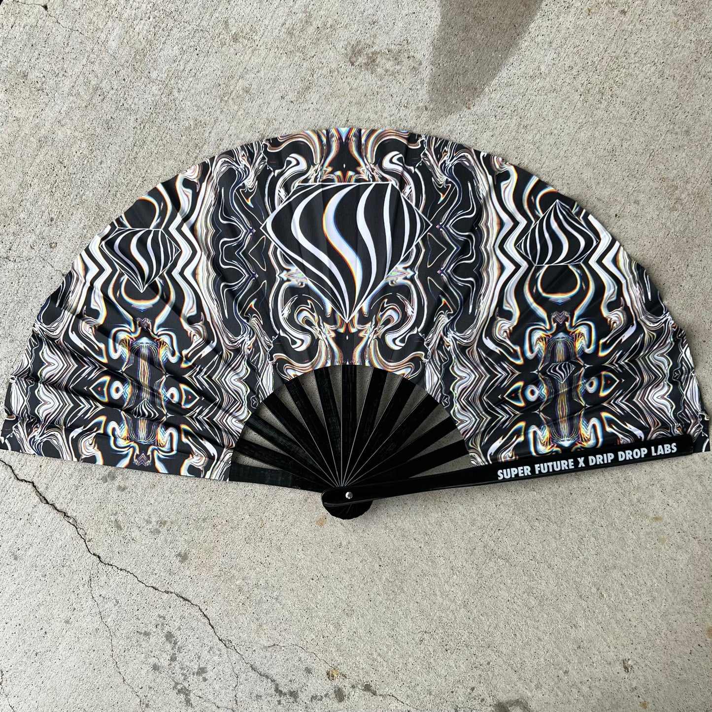Drip Drop Labs Super Future Glow Fan, a stylish handheld fan with glowing features and modern design.