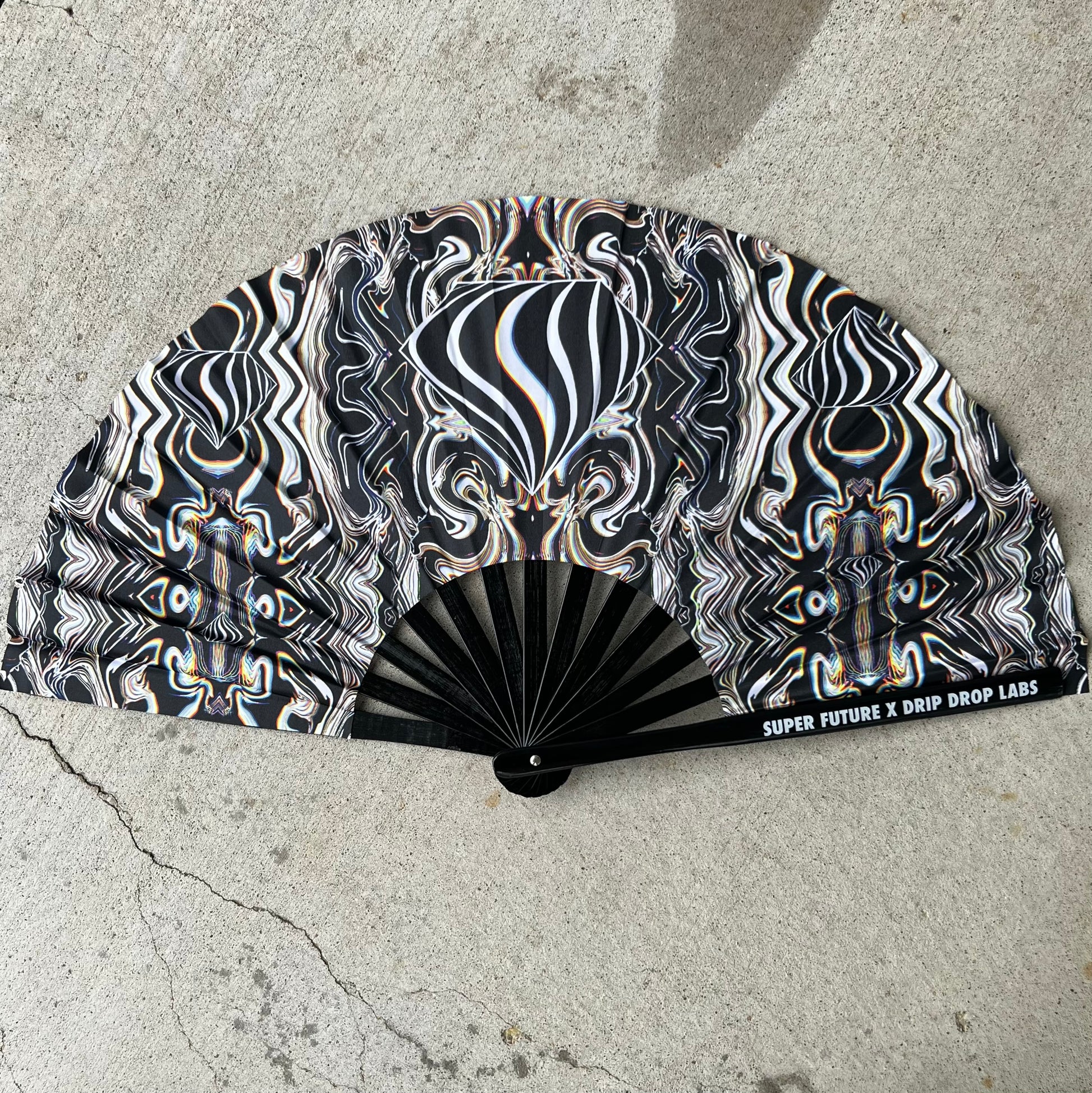 Drip Drop Labs Super Future Glow Fan, a stylish handheld fan with glowing features and modern design.