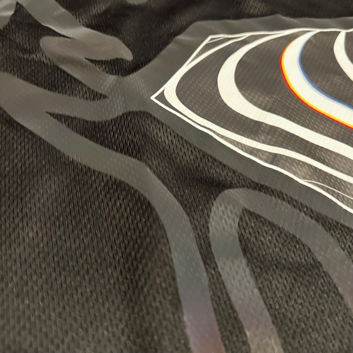 Holo hockey jersey by Drip Drop Labs featuring vibrant holographic design and team logo, displayed on a mannequin.