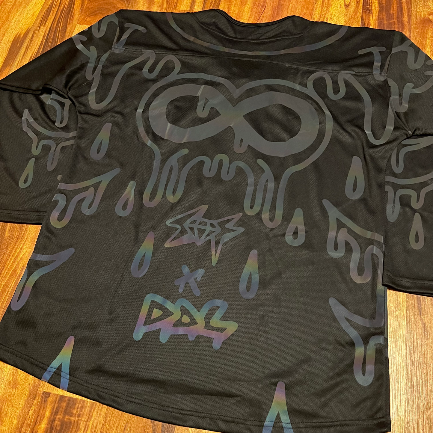 Holo hockey jersey by Drip Drop Labs featuring a futuristic holographic design and sports jersey style.