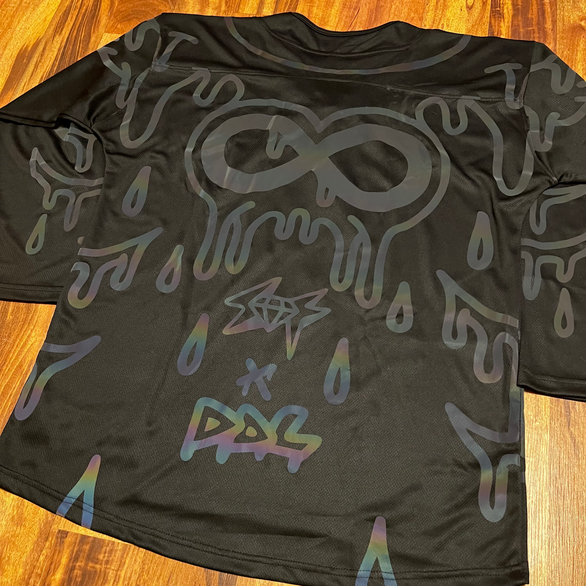 Holo hockey jersey by Drip Drop Labs featuring a futuristic holographic design and sports jersey style.
