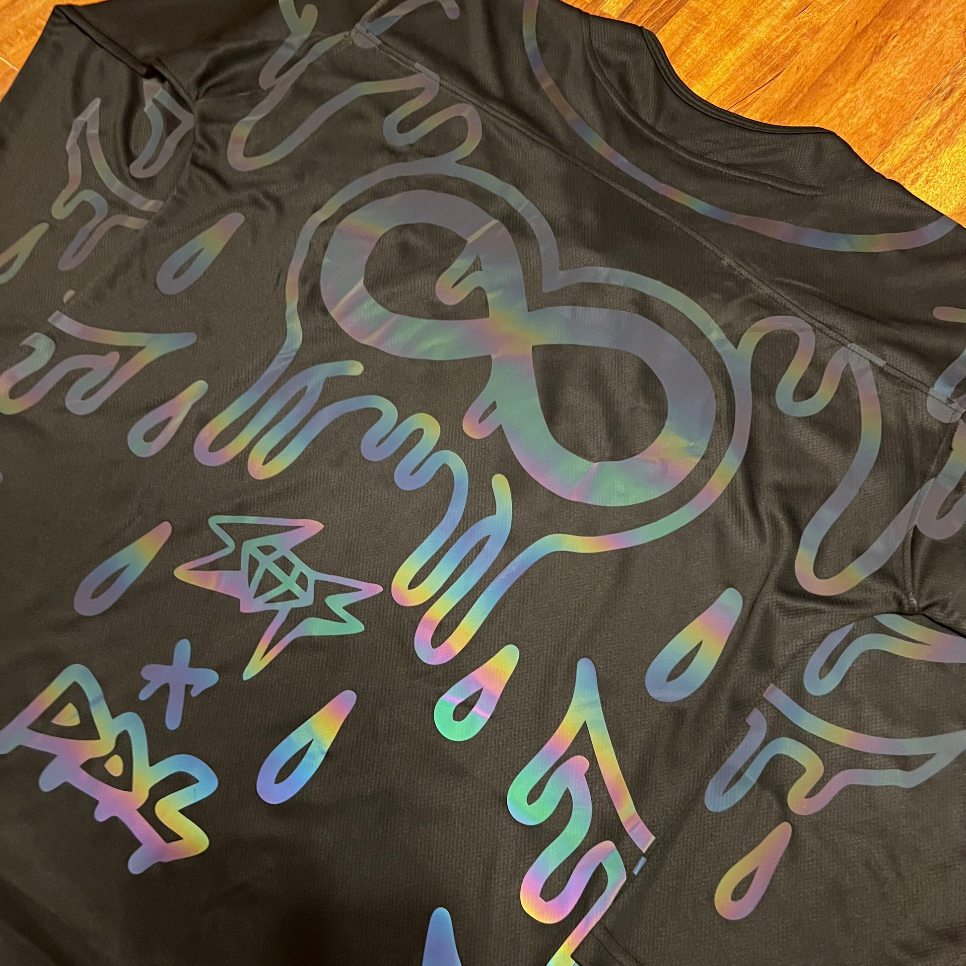 Holo hockey jersey by Drip Drop Labs featuring a shiny, holographic design with team logo and vibrant colors.