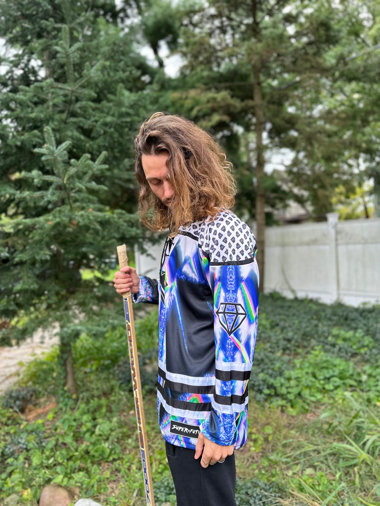 Super Future Infinite Drip Hockey Jersey by Drip Drop Labs, featuring bold graphics and vibrant colors on a stylish sports jersey.
