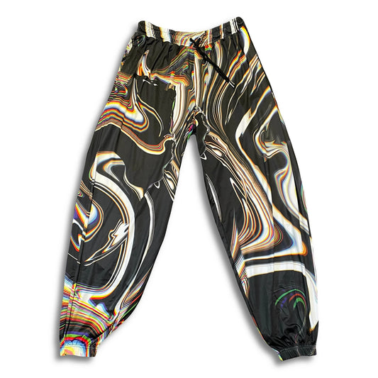 Drip Drop Labs Super Future parachute pants made of lightweight, flowing fabric with a relaxed fit and adjustable waistband.