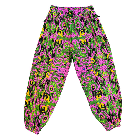 Drip Drop Labs V2 Wild Forest parachute pants featuring green camouflage fabric and a relaxed fit for casual wear.