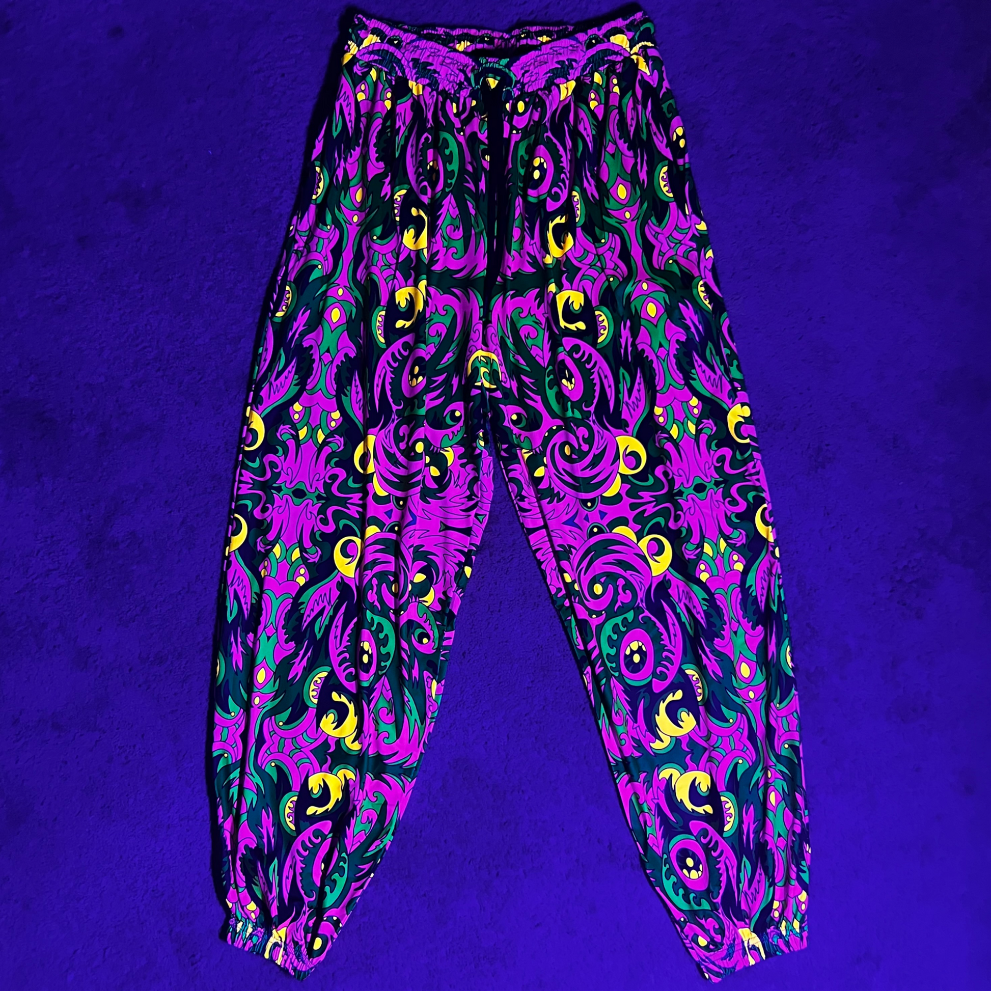 Drip Drop Labs V2 Wild Forest parachute pants with adjustable drawstrings and vibrant forest print design.