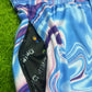 Drip Drop Labs Waves parachute pants in lightweight fabric with a relaxed fit and wave pattern design.