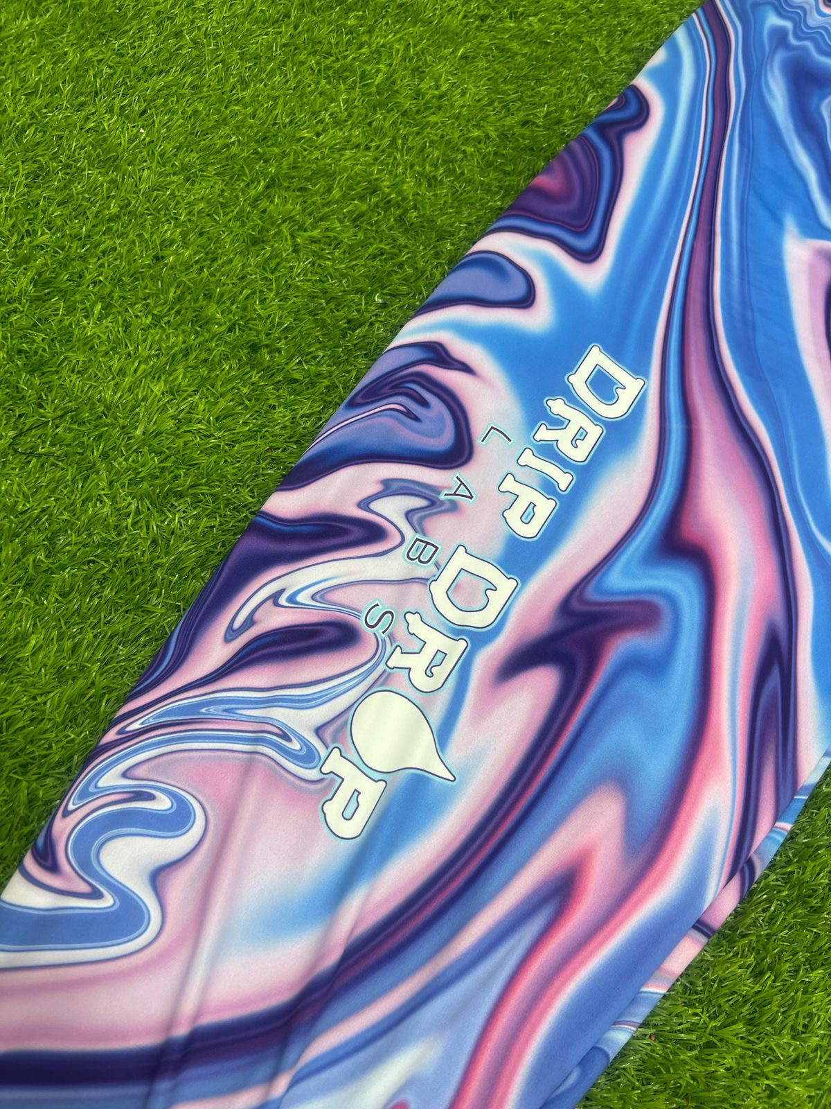 Drip Drop Labs Waves parachute pants in lightweight fabric with a relaxed fit and wave pattern design.