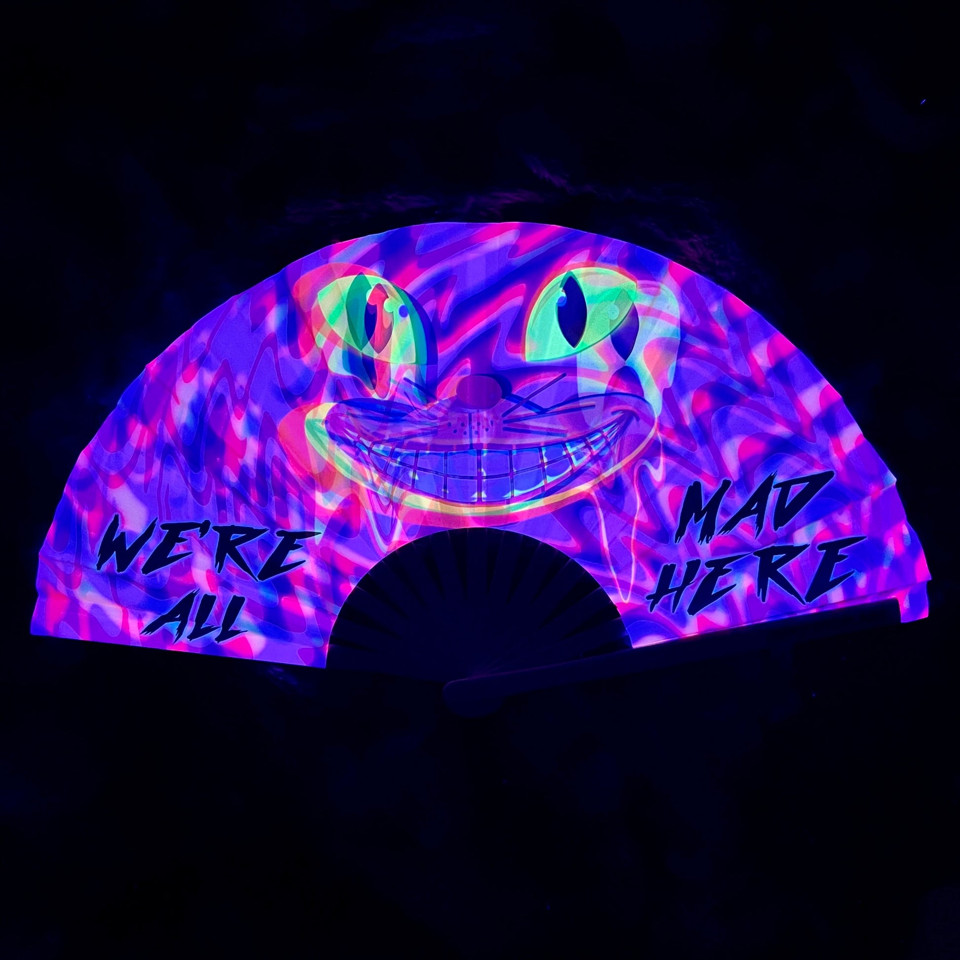 Drip Drop Labs We’re All Mad Here glow fan displaying vibrant, colorful LED lights with a whimsical design.