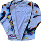 White Chromatic Drip Zip Up Hood Windbreaker by Drip Drop Labs, showing the stylish windbreaker with hood and zip closure.
