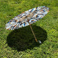 White Chromatic OG Parasol by Drip Drop Labs, stylish parasol with a sleek white design and chrome finish.