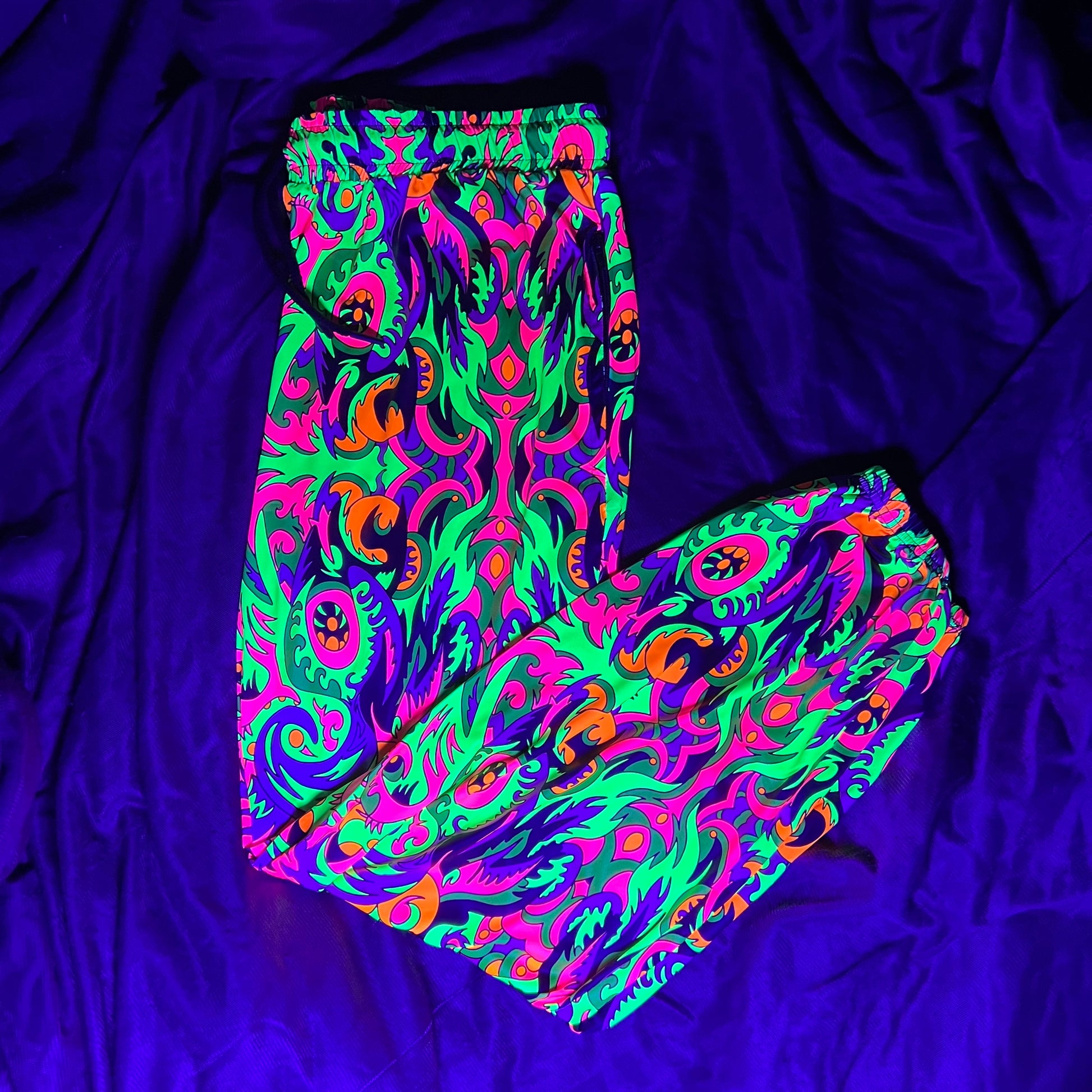 Wild Forest parachute pants by Drip Drop Labs featuring lightweight fabric, adjustable waist, and a relaxed fit.