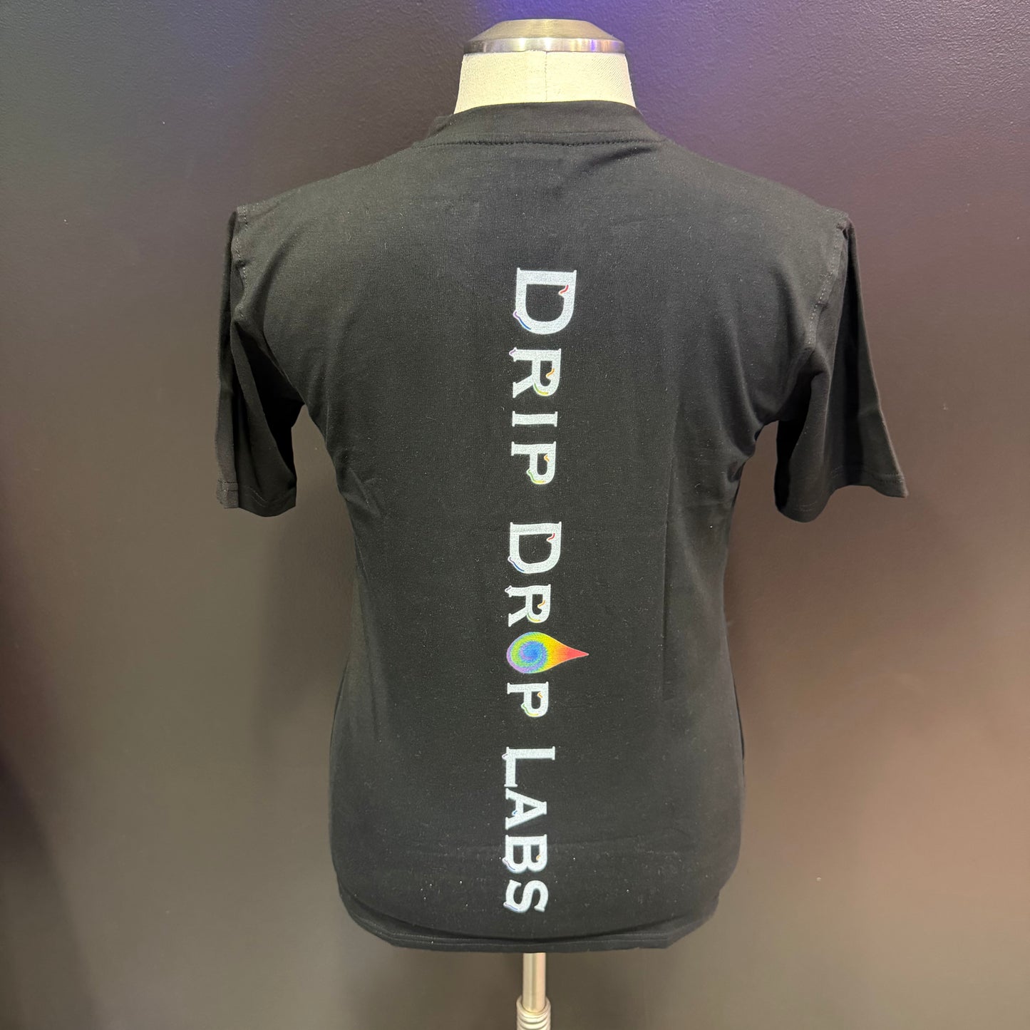 Women's V-neck shirt with rainbow compound pattern by Drip Drop Labs, featuring vibrant colors and comfortable fit.