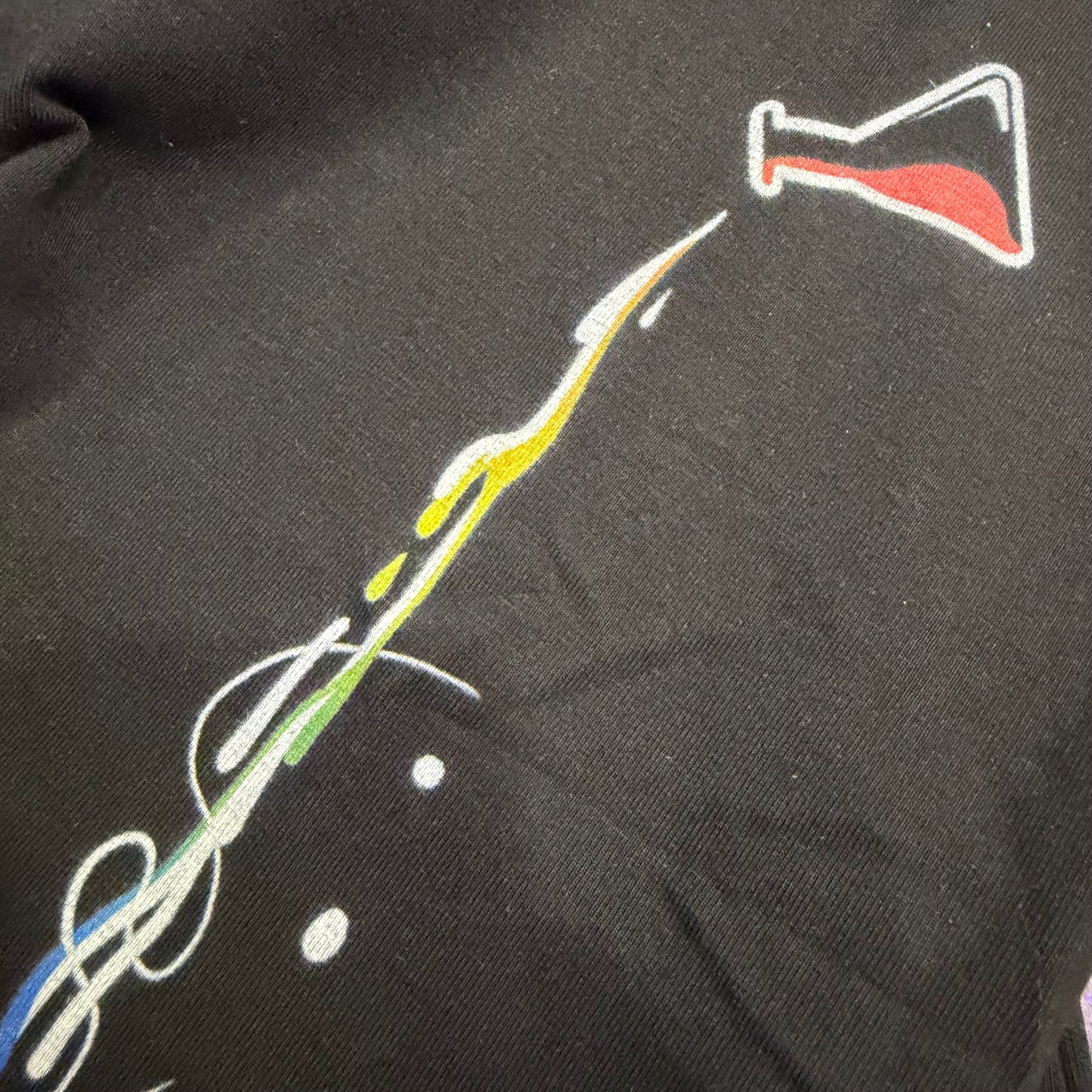 Women’s V-neck shirt by Drip Drop Labs featuring a vibrant rainbow compound design, casual and stylish for everyday wear.