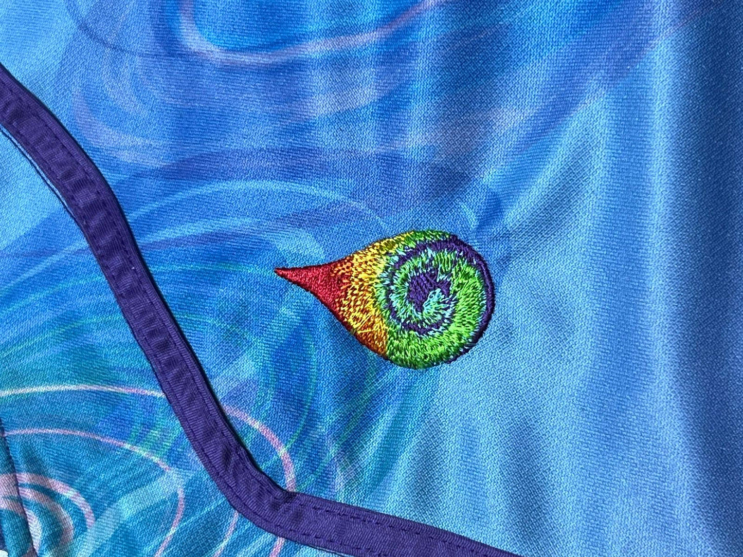 Drip Drop Labs Zodiac Flower hooded baseball jersey featuring floral design and baseball style, made with comfortable fabric.