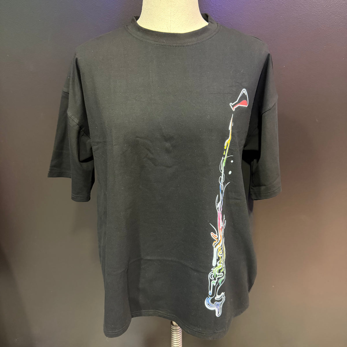 Oversized rainbow-colored shirt by Drip Drop Labs featuring vibrant rainbow compound design and relaxed fit.