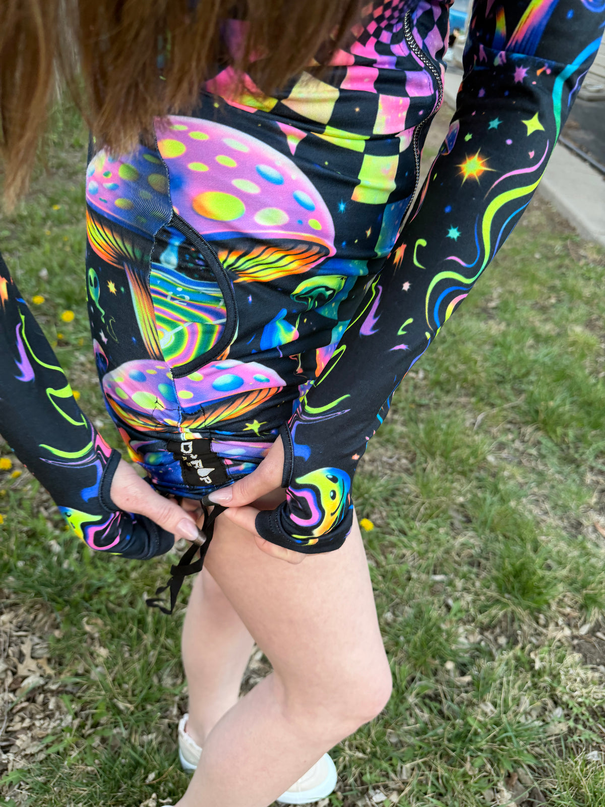 Rainbow Portal Hooded Rave Romper by Drip Drop Labs featuring a colorful, psychedelic design with a hood and festival-ready style.