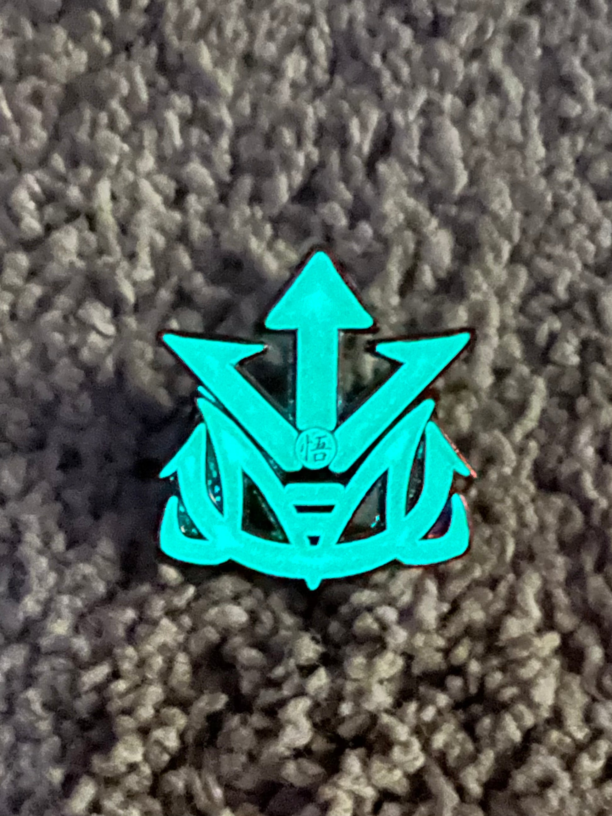 Kingdesigns26 SaiyanPride pins featuring a detailed Saiyan logo on a shiny metal pin.