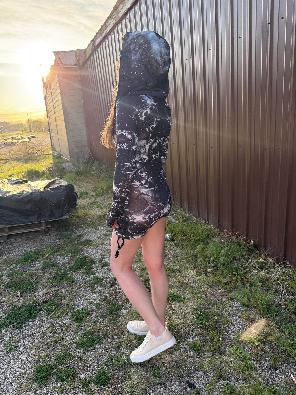 Dark galactic hooded rave romper by Drip Drop Labs featuring a celestial starry print and comfortable festival fit.
