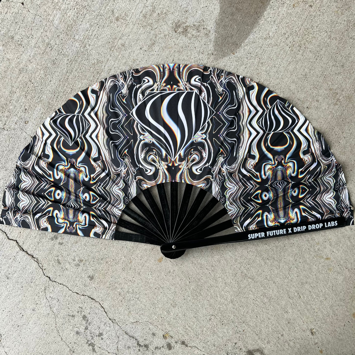 Drip Drop Labs Super Future Glow Fan, a stylish handheld fan with glowing features and modern design.