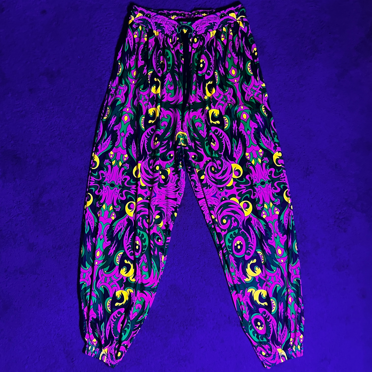Drip Drop Labs V2 Wild Forest parachute pants with adjustable drawstrings and vibrant forest print design.